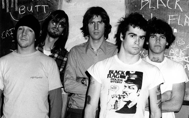 Henry Rollins posing for a photo with Black Flag.